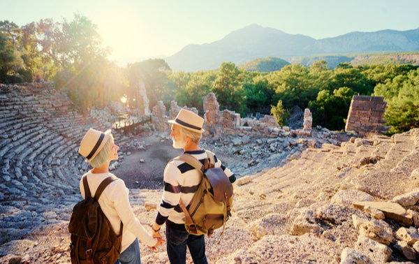 A mature couple visiting an ancient amphitheatre.