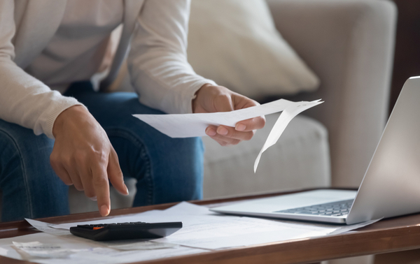 A person looking through paperwork.