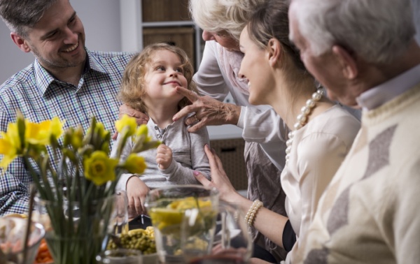 Multi-generation family having dinner together.