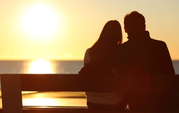 A couple looking out to the ocean.