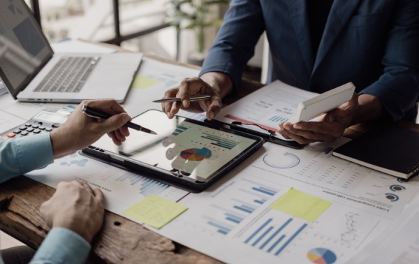 Business people looking at documents in an office.